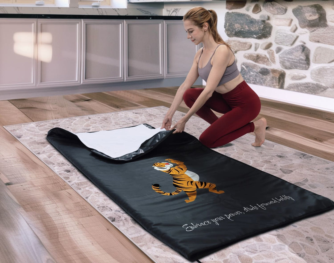 Enercozy 'Wild Orange Wander' Infrared Sauna Blanket in use, demonstrating its energizing color and how it provides warmth and encourages an adventurous spirit.